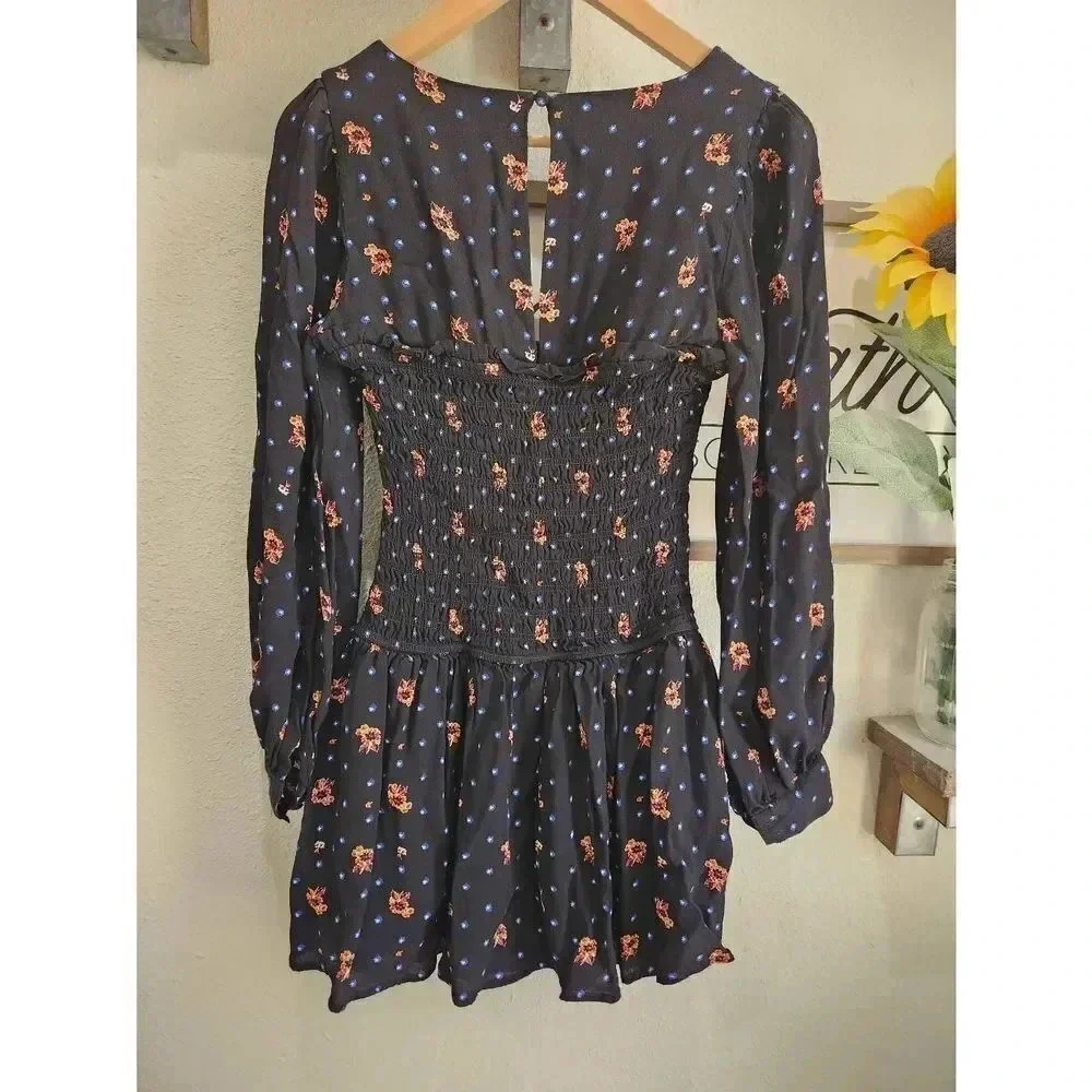 Free People Two Faces Smocked Bodice Floral Mini Dress Long Sleeved Size XS.